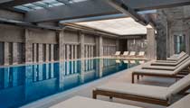 The indoor swimming pool, a calm relaxing space with loungers for guest to relax between swims