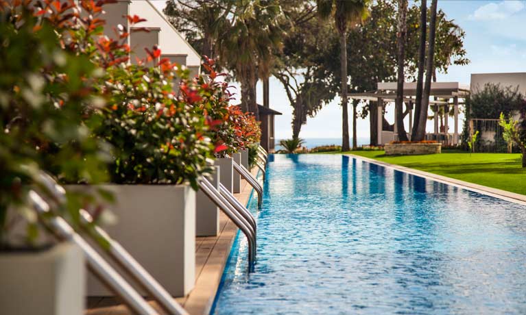 Swim-up rooms opposite the landscaped hotel gardens