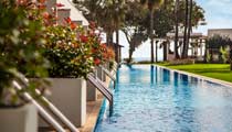 Swim-up rooms opposite the landscaped hotel gardens