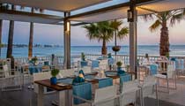 A Barut Collection restaurant at sunset where guests can dine with beautiful views over the clear blue sea