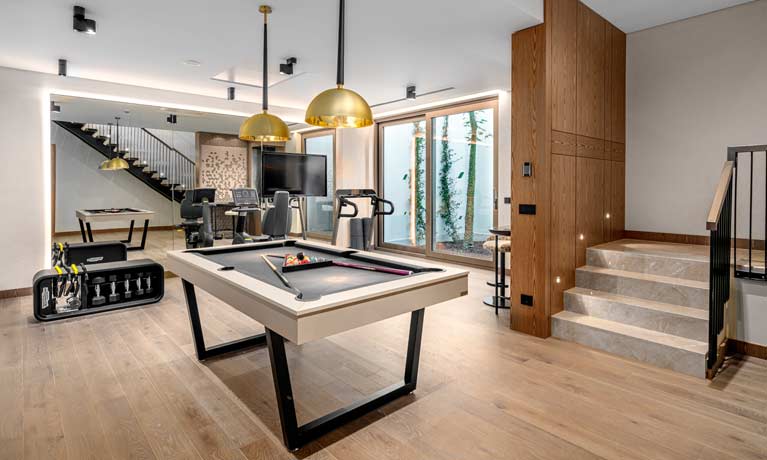 A games room with pool tables and other leisure activities provided for guests