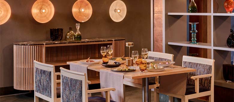 A table is set for evening dinner service at one of several restaurants for guests to choose from at Bayou Villas