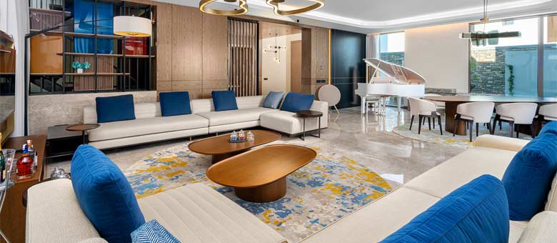 The huge lounge area in the Four Bedroom Villa, complete with large corner sofas and even a grand piano!