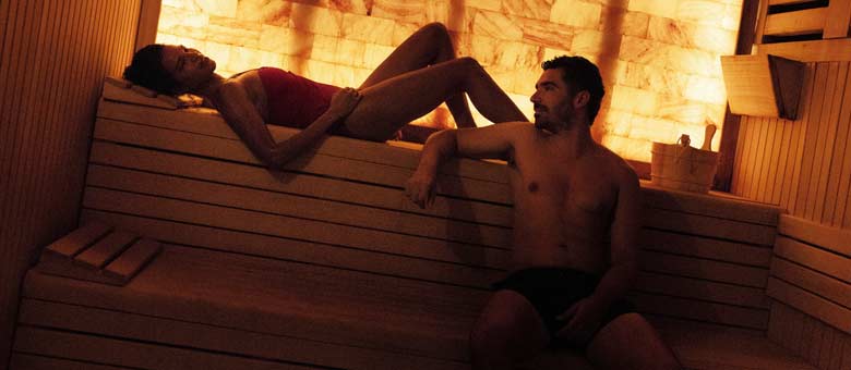 A couple relax in the sauna during a session at the Spa