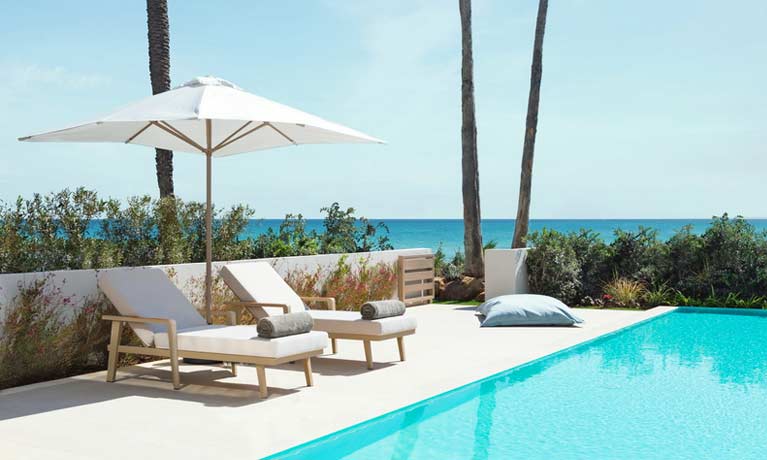 The garden of a Deluxe Collection suite featuring a private swimming pool.