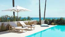 The garden of a Deluxe Collection suite featuring a private swimming pool.