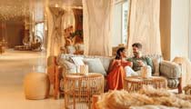 A couple enjoy an evening drink in a bar exclusively reserved for Deluxe Collection guests.