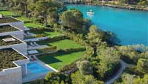 Aerial view of bungalow suites with private pools and large gardens.