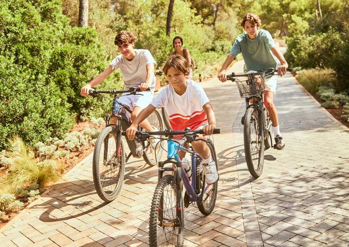 An example of the sports activities available at Ikos Resorts. Children having fun riding bikes supplied by the hotel.