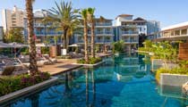 One of the hotel's main outdoor swimming pools, with crystal clear inviting water and surrounded by palm trees it is a calm relaxed environment